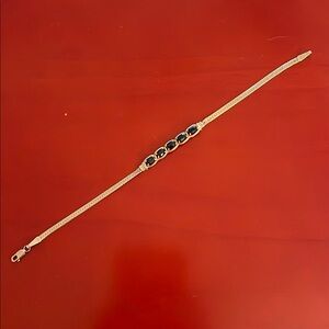 Elegant Gold Bracelet with Black Stones